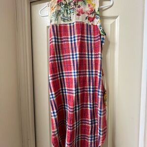Floral in the front. Plaid in the back.  Long length and sleeveless button down